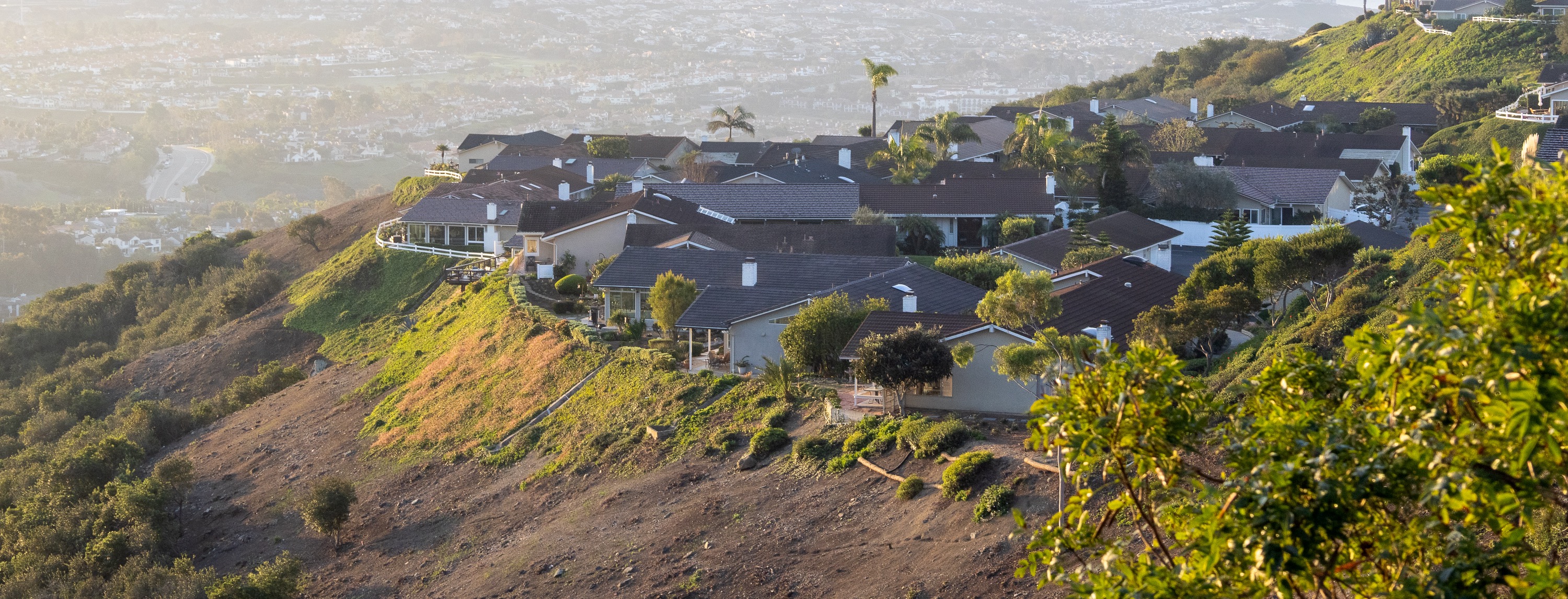 South Orange County hillside homes in warm afternoon light